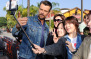 UNIVERSAL CITY, CA - FEBRUARY 18:  Josh Duhamel takes a selfie with fans at "Extra" at Universal Studios Hollywood on February 18, 2015 in Universal City, California.  (Photo by Noel Vasquez/Getty Images)