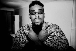 American disc jockey, rapper, songwriter and producer Afrika Bambaataa wears wacky eyewear in 1980