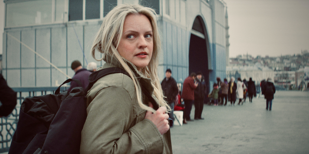 Elisabeth Moss looks over her shoulder in the Hulu series 'The Veil'